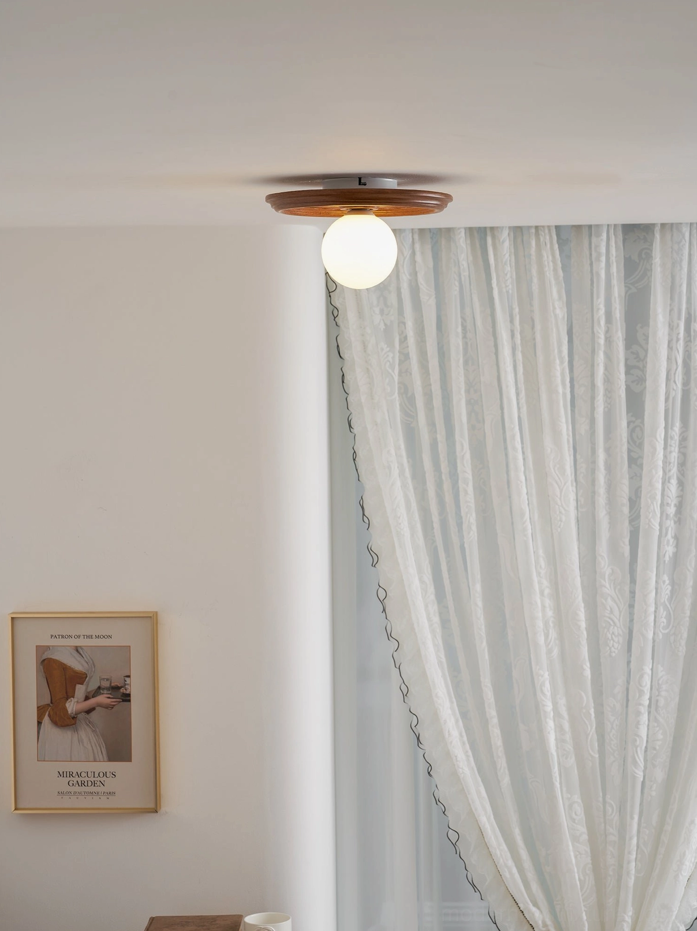 Beige resin ceiling light fixture with soft diffused warm lighting in modern home