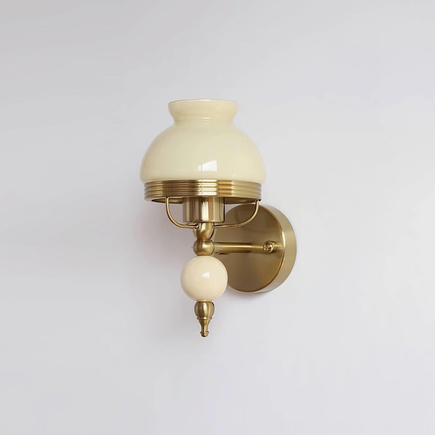 Beige retro wall sconce with delicate frosted glass floral motif and brass frame