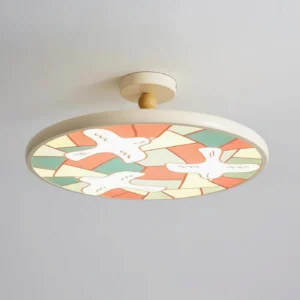 Close-up overhead view of cream-colored beige stained glass bird flush mount ceiling light with wooden mounting cap