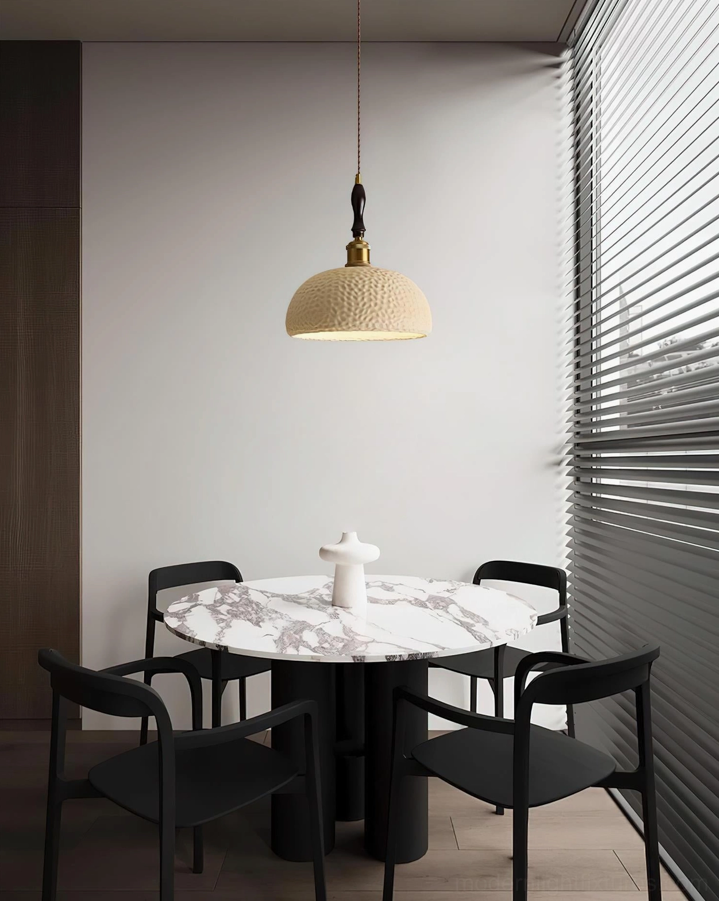 Beige hammered resin pendant lamp above dining table with window blinds, minimalist home decor