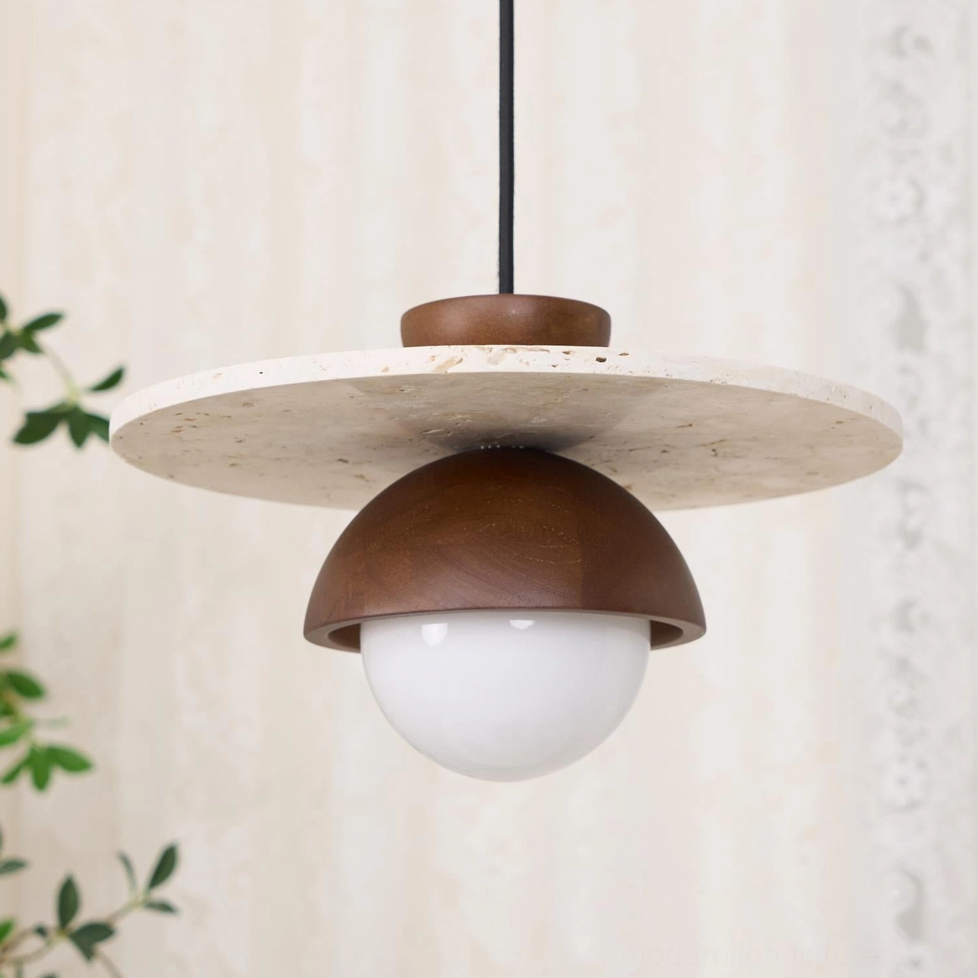 Mid-century modern pendant lamp with beige travertine and frosted glass globe for ambient lighting