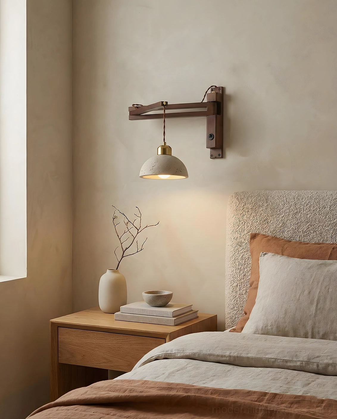 Beige travertine wall sconce with wooden swing arm in neutral bedroom environment, compact modern wall-mounted lighting design