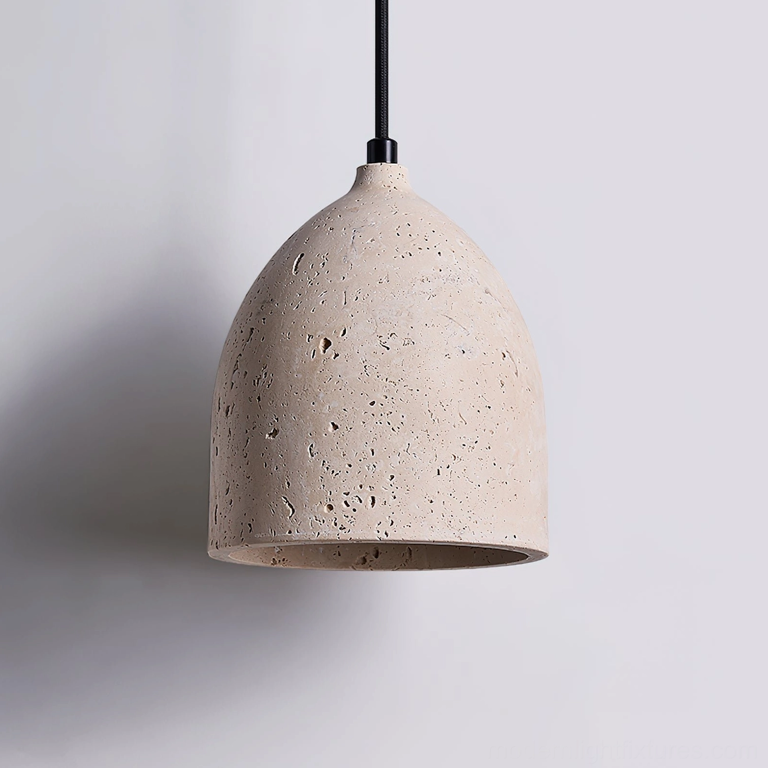 Single head travertine volcanic pendant light in beige displaying natural color variation and porous stone character