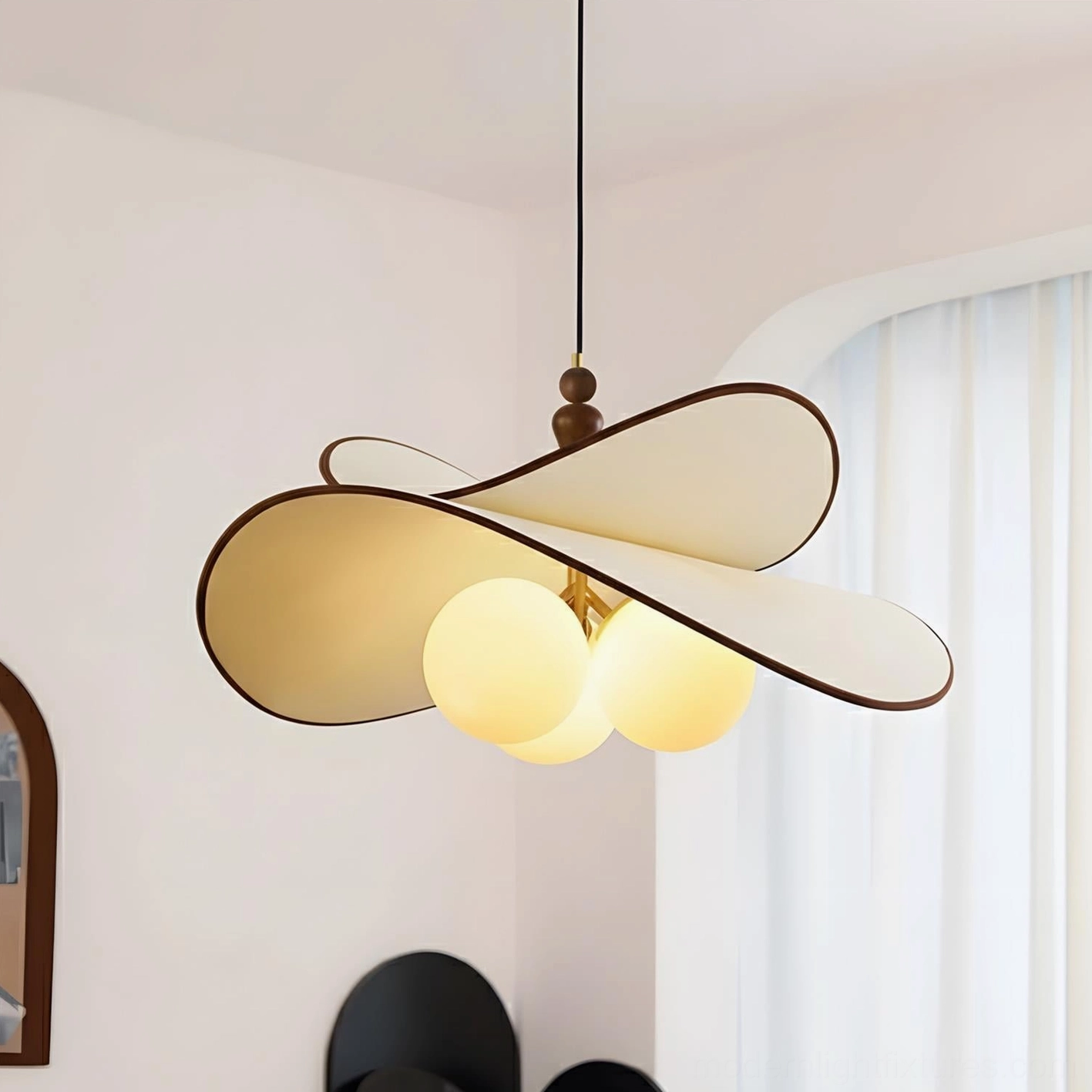 Beige and white petal pendant light with three warm glowing glass spheres, elegant mid-century modern fabric pendant chandelier variant