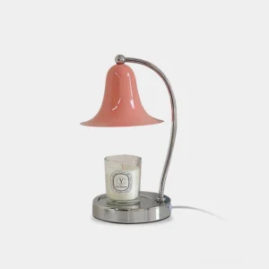 Bell Candle Warmer Lamp with pink glass shade and chrome metal frame, front view on white studio background