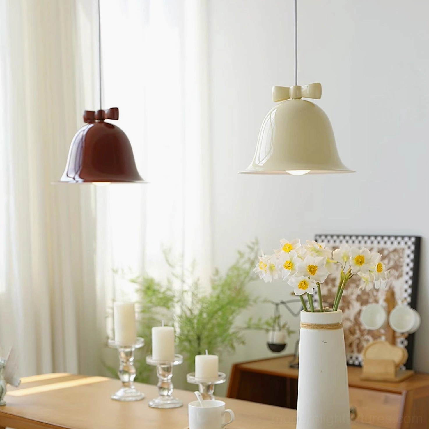 Ceramic bell-shaped pendant light with brown bow in warm interior ambient lighting scene