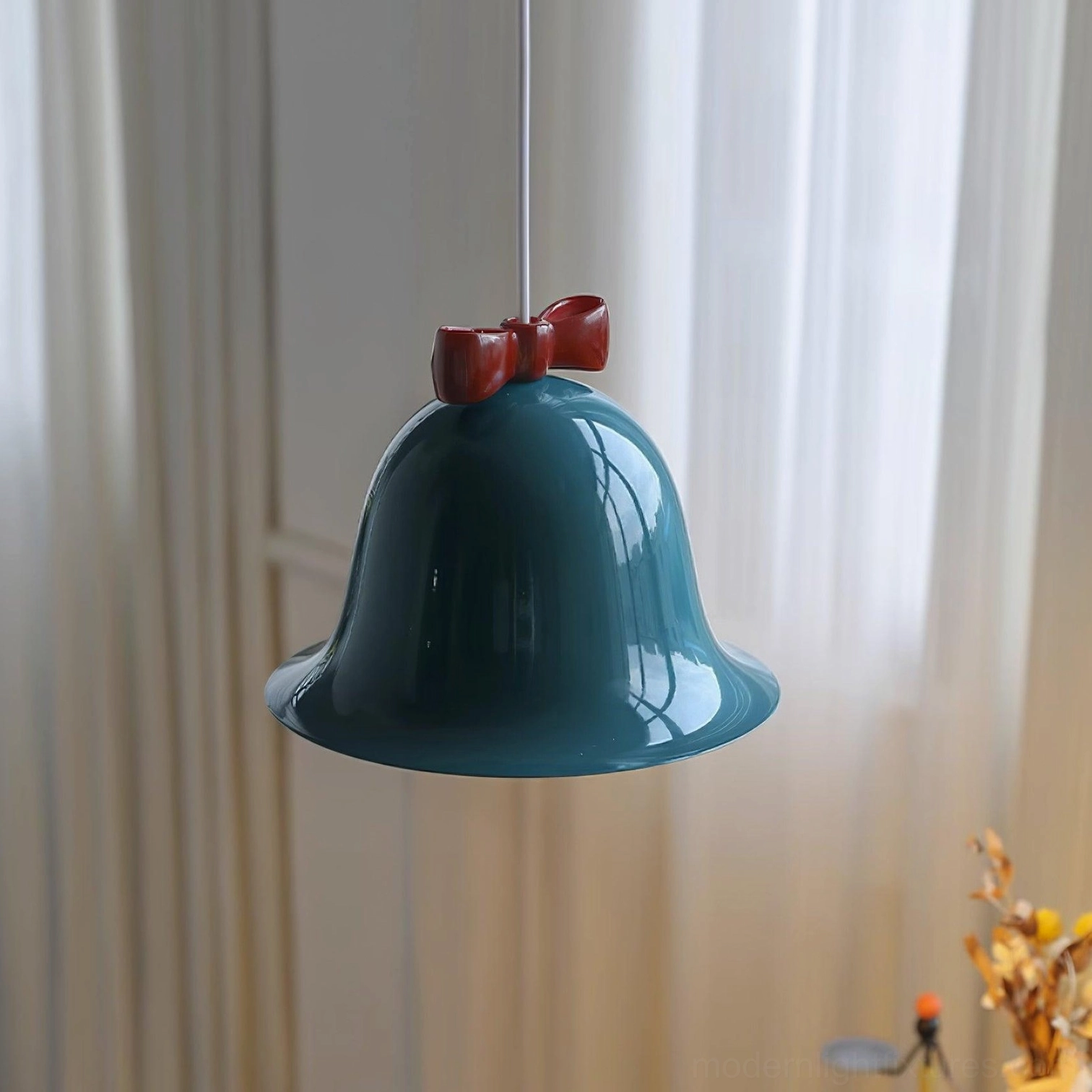 Bell pendant lamp showing light diffusion through glossy ceramic shade in room illumination