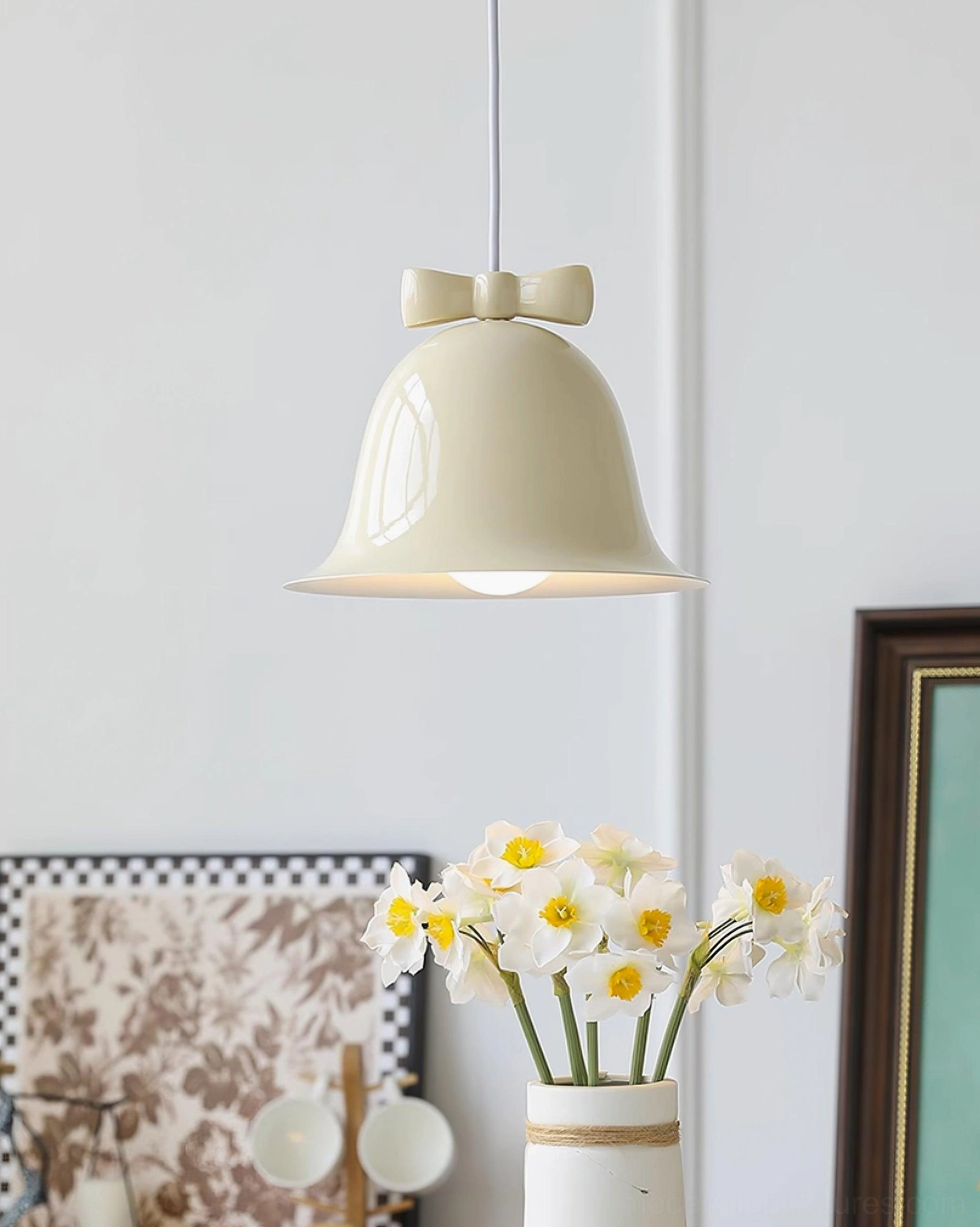 Ceramic bell-shaped pendant with bow detail in living room corner accent lighting scene