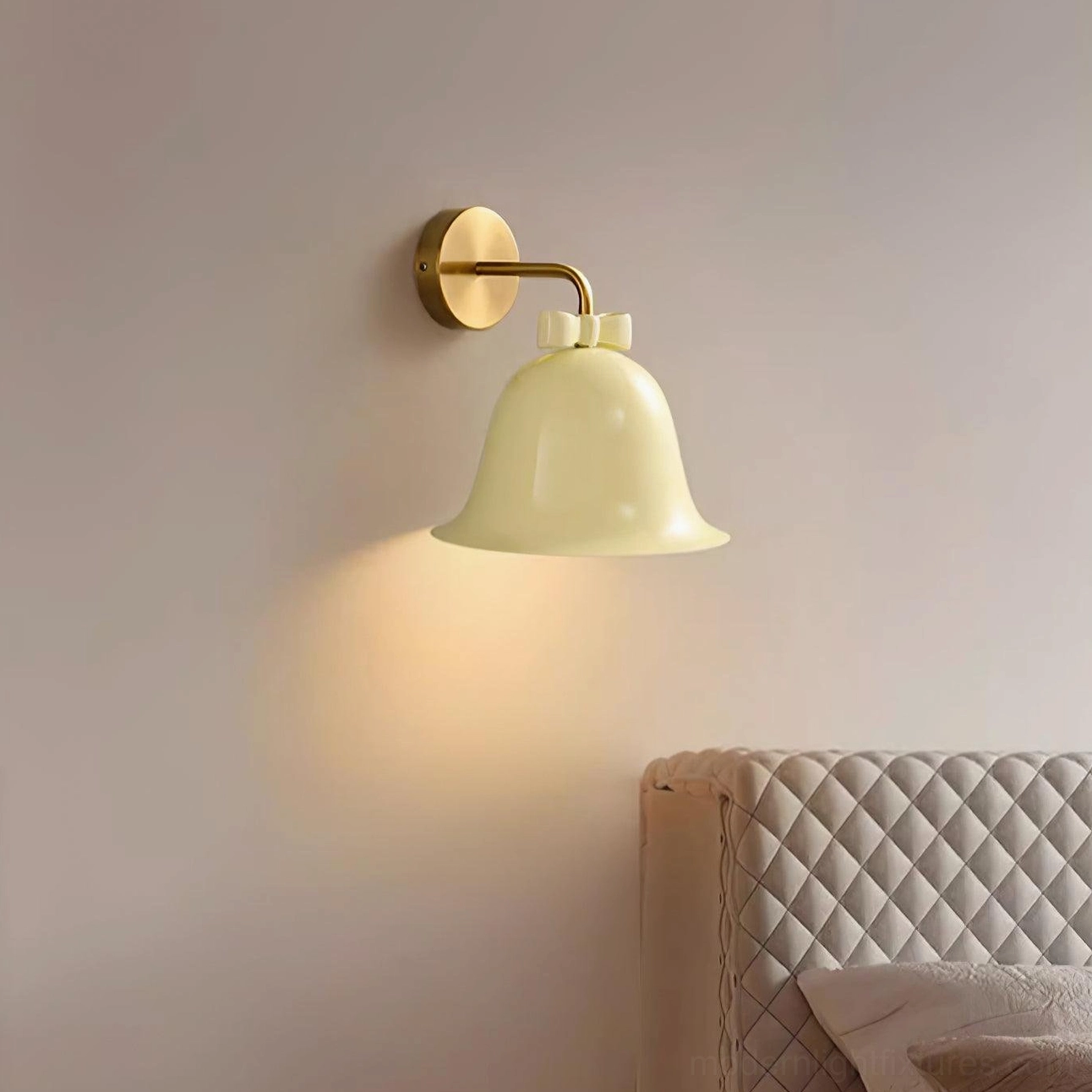 Bell-shaped wall sconce close-up showing detailed ceramic finish and decorative bow knot craftsmanship