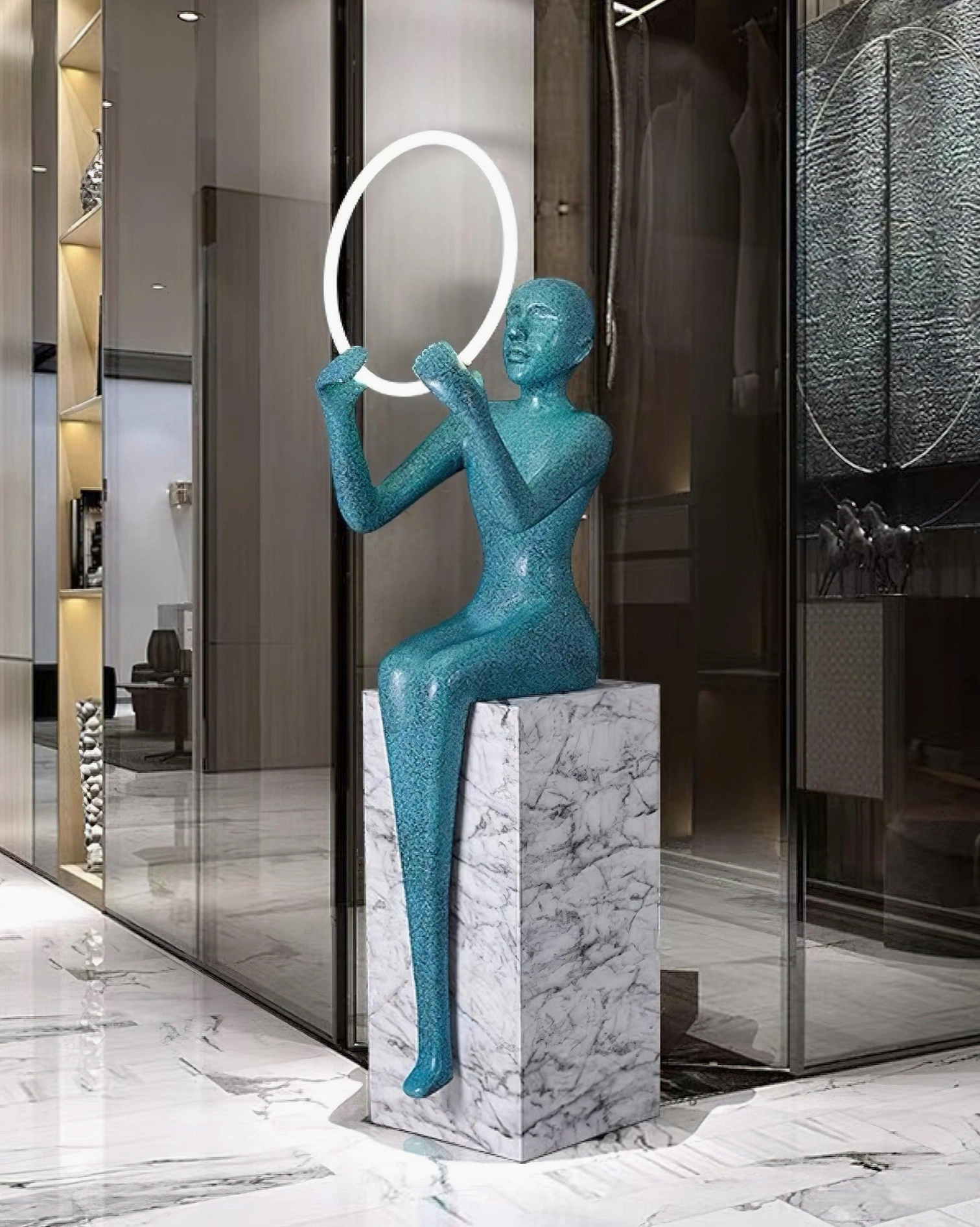 Teal blue sculptural halo floor lamp with marble pedestal in luxury living room environment