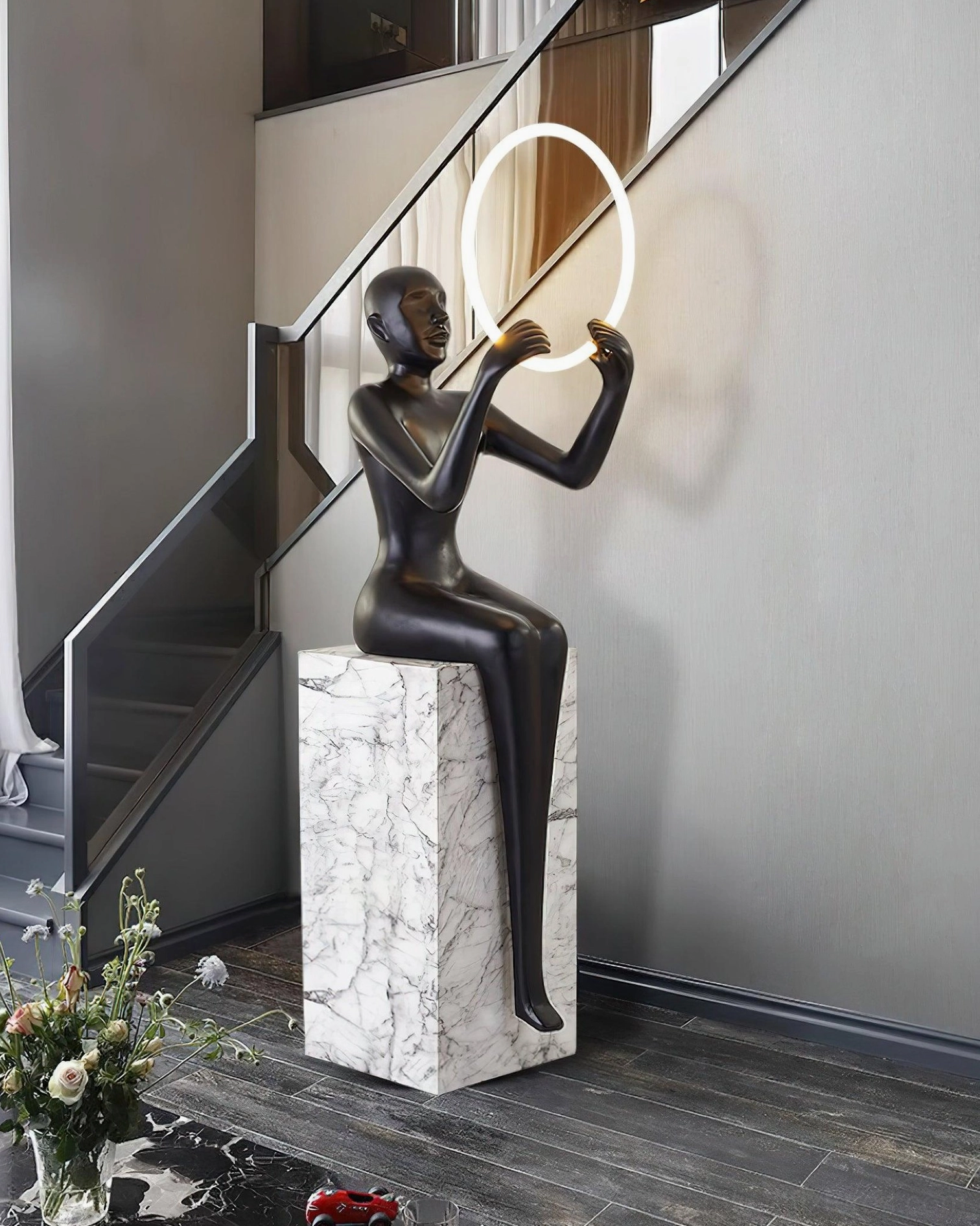 Bella modern sculptural halo floor lamp with integrated LED ring light and resin base detail