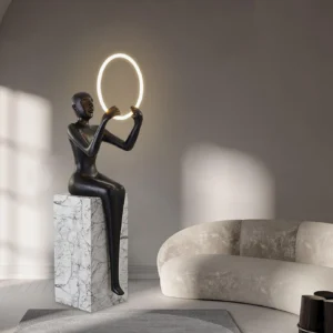 Bella modern sculpture floor lamp with glowing LED halo ring, three-quarter perspective showing artistic form