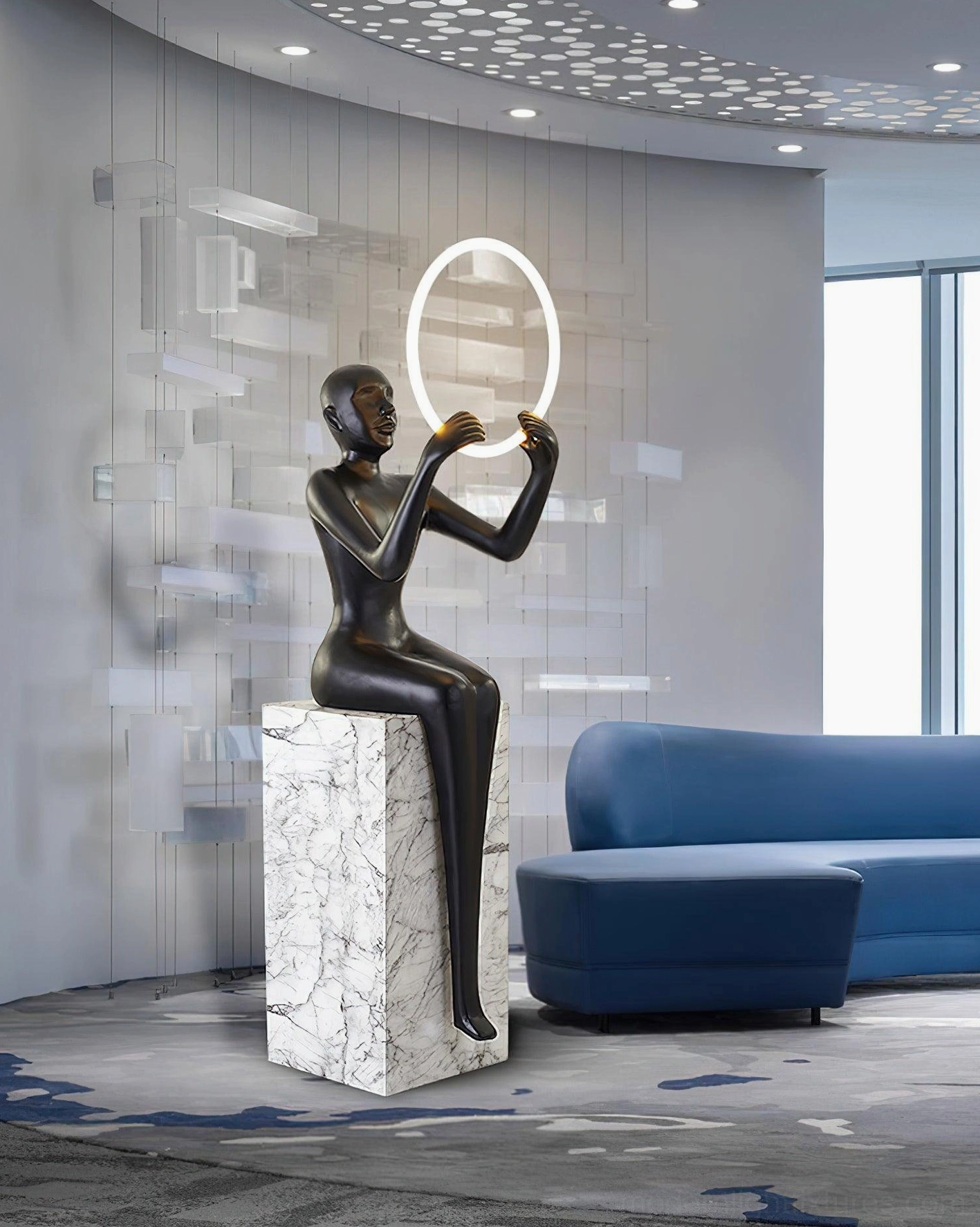 Bella matte black sculptural halo floor lamp with warm LED ring in modern minimalist lounge