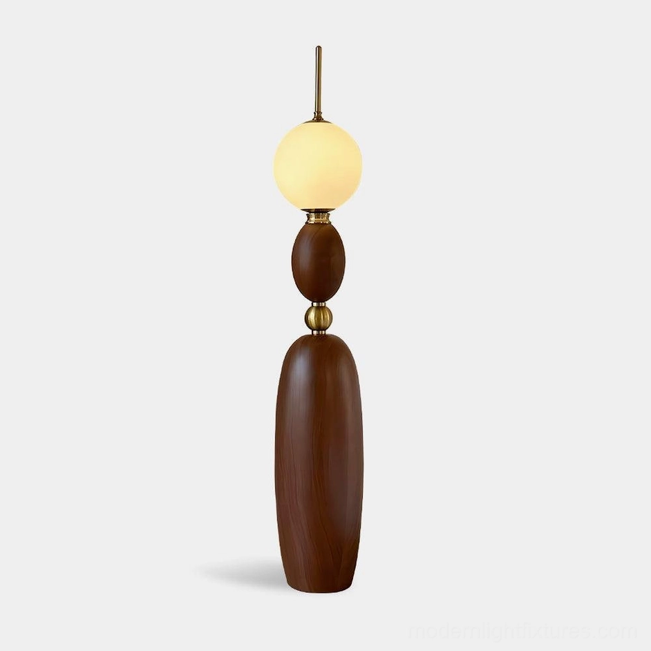 Bellamy modern floor lamp with warm wood tone and frosted glass globe shade, front studio view
