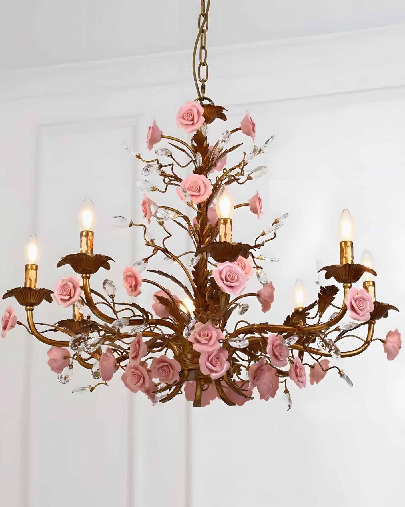 Bellara rose chandelier warm candlelight glow in elegant formal dining room ambiance