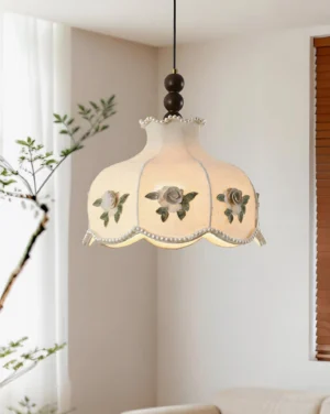 Vintage rose embroidered pendant lamp in living room corner showing warm neutral fabric and walnut wood hardware