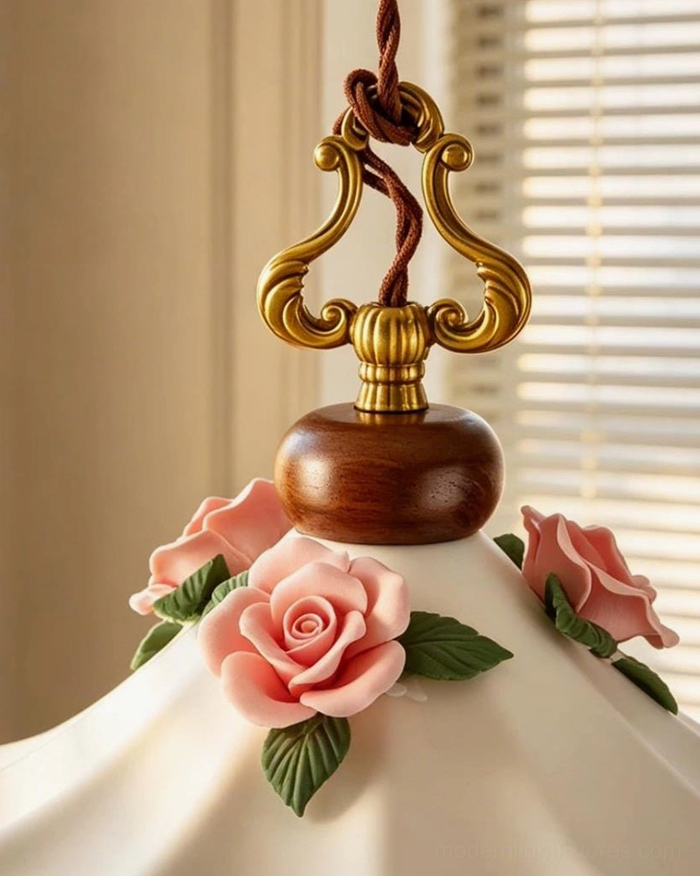 Bellarose pendant light with pleated ceramic shade, hand-applied roses and green leaves, brass swan-neck hook