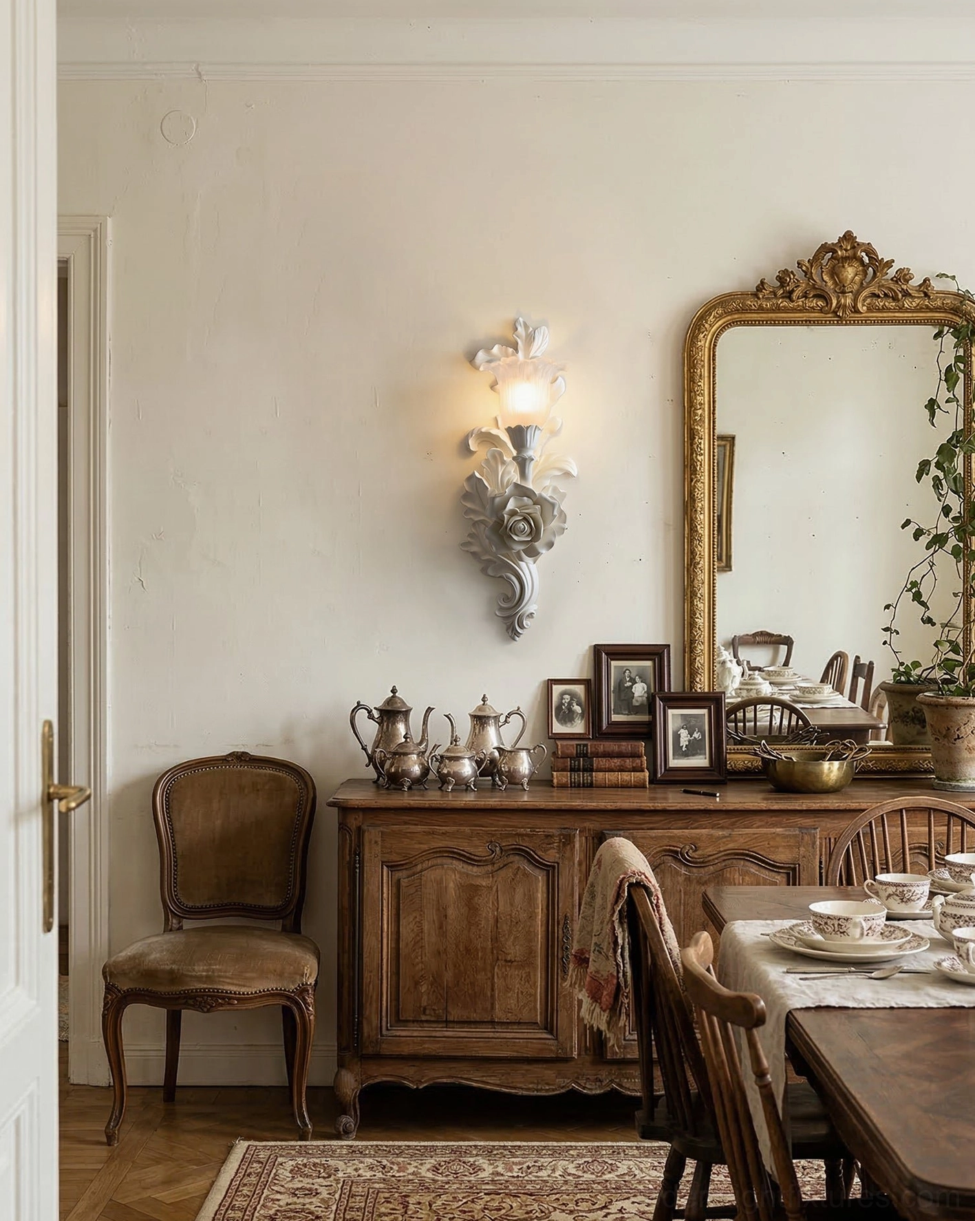 Bellarose wall sconce in formal dining room paired with dark wood furniture and traditional decor