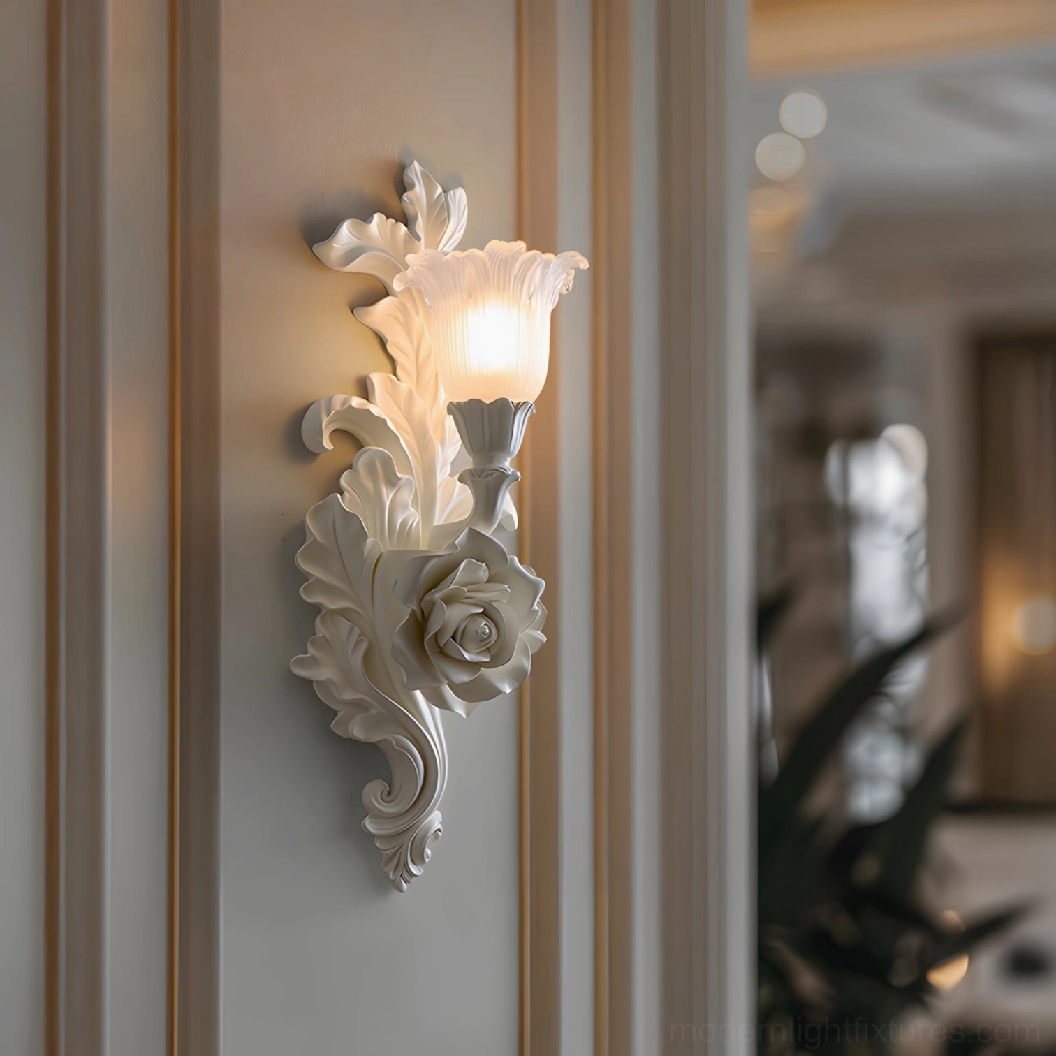 Illuminated Bellarose wall sconce with carved floral decorative details on residential bedroom accent wall