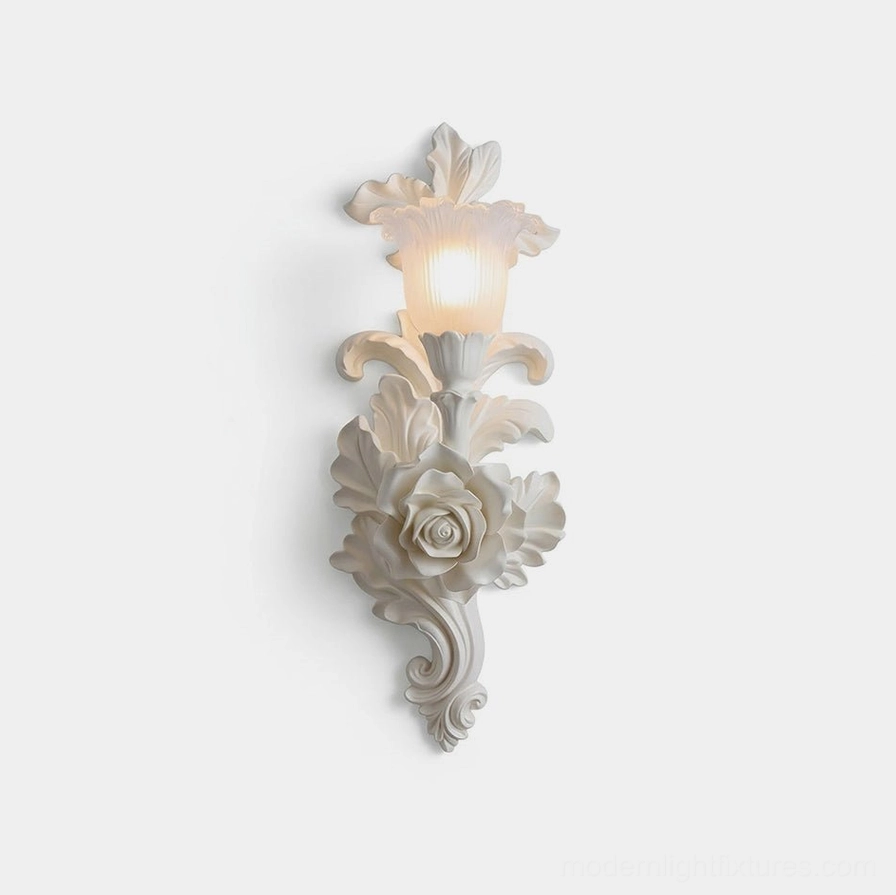Bellarose ornate white wall sconce with rose-carved plaster body and frosted glass shade, frontal studio view