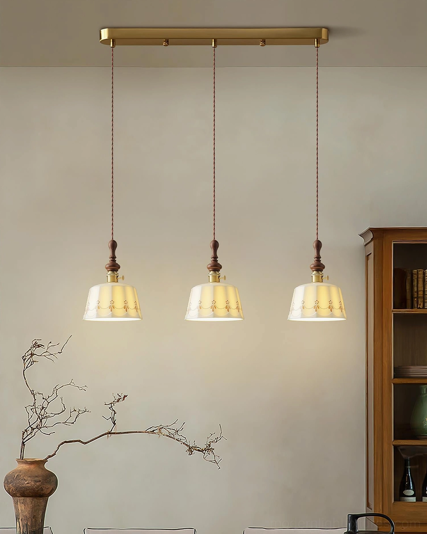 Three-head Belle Fleur pendant fixture over dining table with brass ceiling bar and matching vintage units