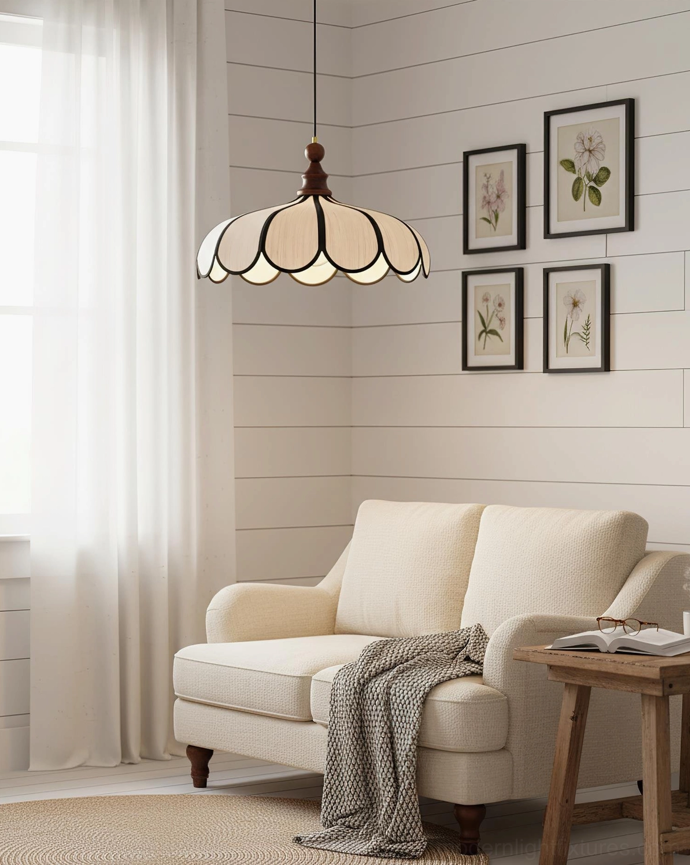 Bellerin Abaca shade pendant lamp illuminated in cozy minimalist living room with neutral palette and botanical wall art