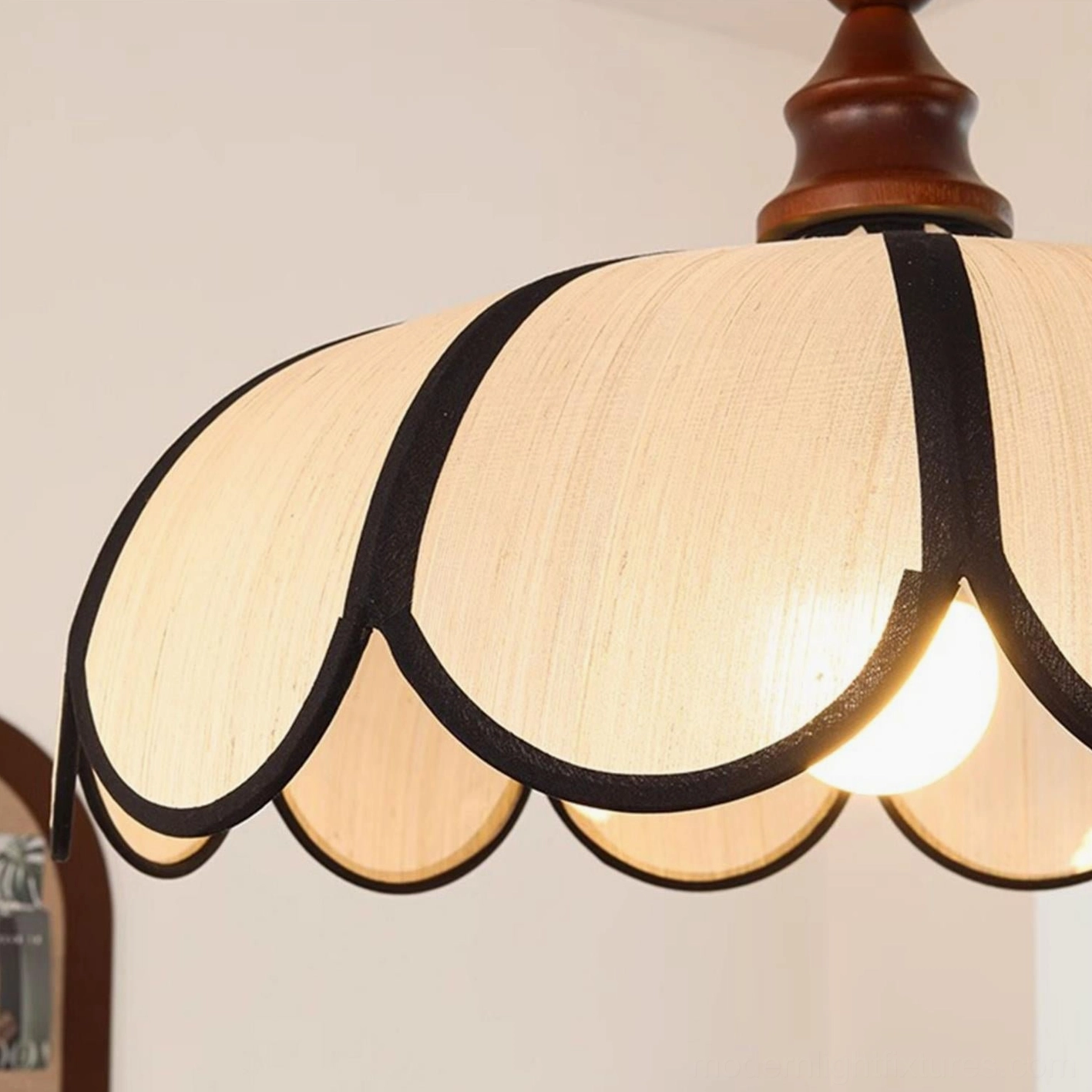 Multiple Bellerin pendant lamps grouped at staggered heights creating layered botanical focal point