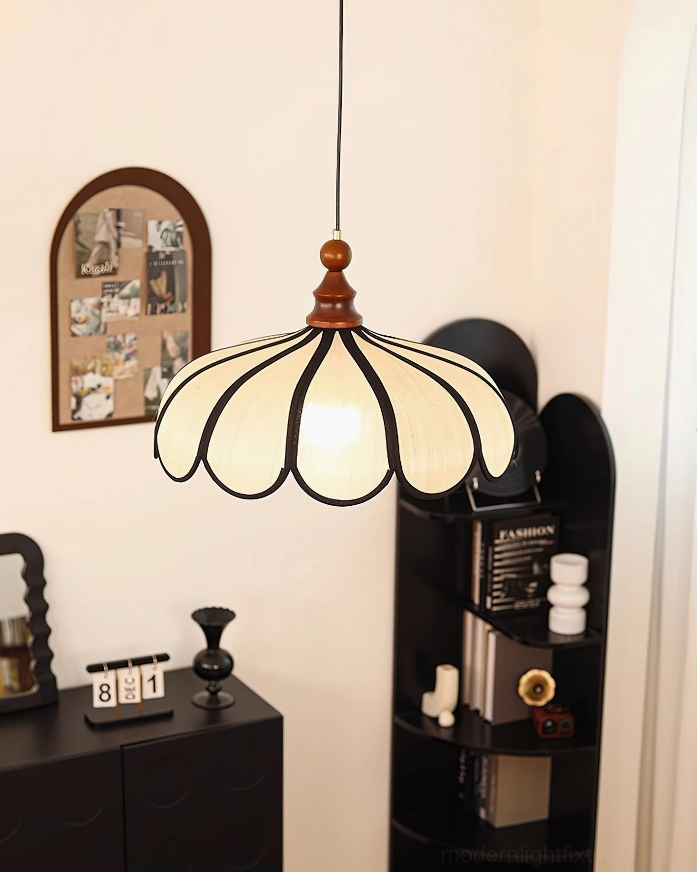 Pair of Bellerin pendant lamps suspended at matching height over modern dining table centerpiece