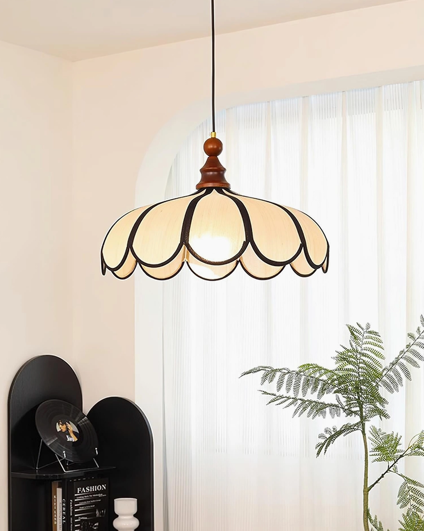 Bellerin pendant lamp side profile view showing lamp proportion, scalloped trim, and directional light quality