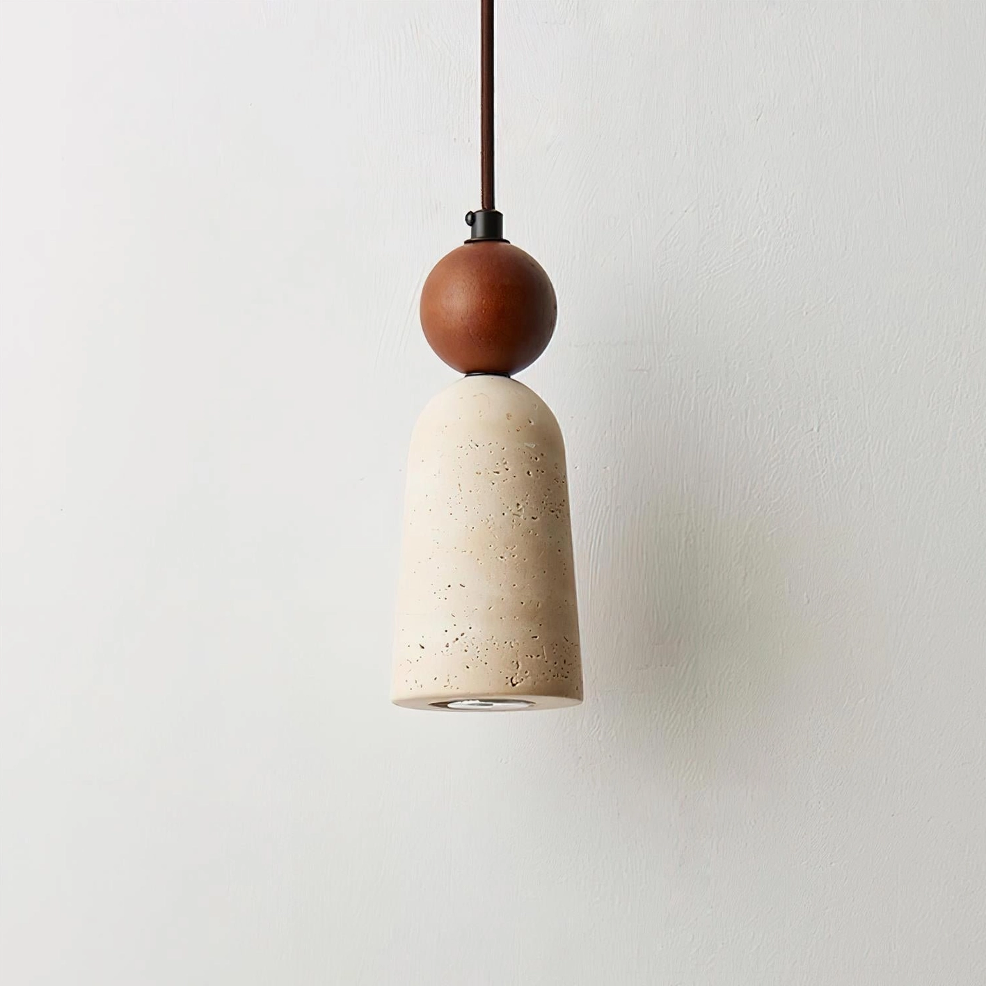 Bellin modern pendant lamp casting warm downlight in Scandinavian minimalist home setting
