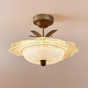 Bellmora champagne gold and white ceiling fixture in living room with rattan chairs and tropical bohemian home decor