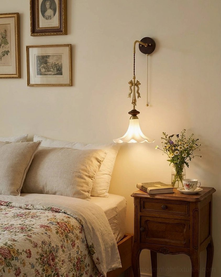 Bellora wall sconce in cozy bedroom with warm neutral decor, floral bedding, and framed artwork