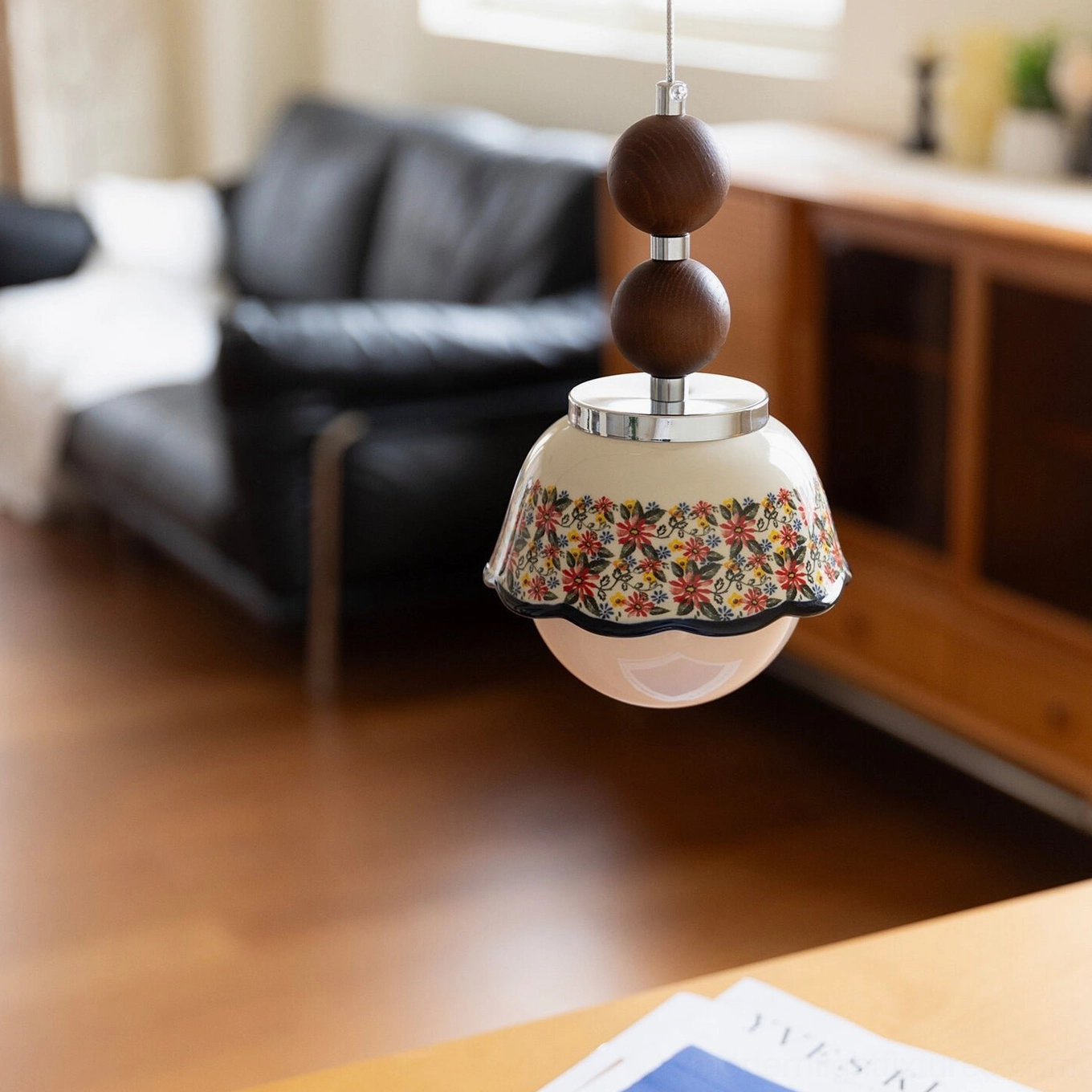 Bellora ceramic floral pendant light with warm white LED glow, walnut wood accents and polished metal fittings for modern home lighting