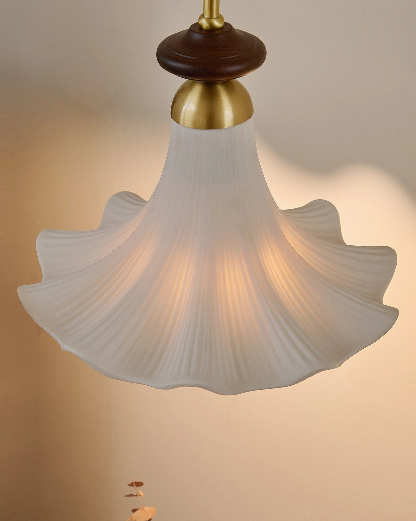 Close-up detail of Bellora frosted glass flower shade with brass and wooden hardware