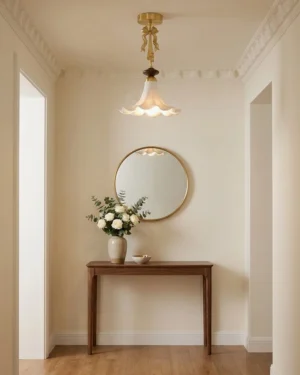 Bellora vintage ceiling light installed in residential entryway above console table with French country warm interior design