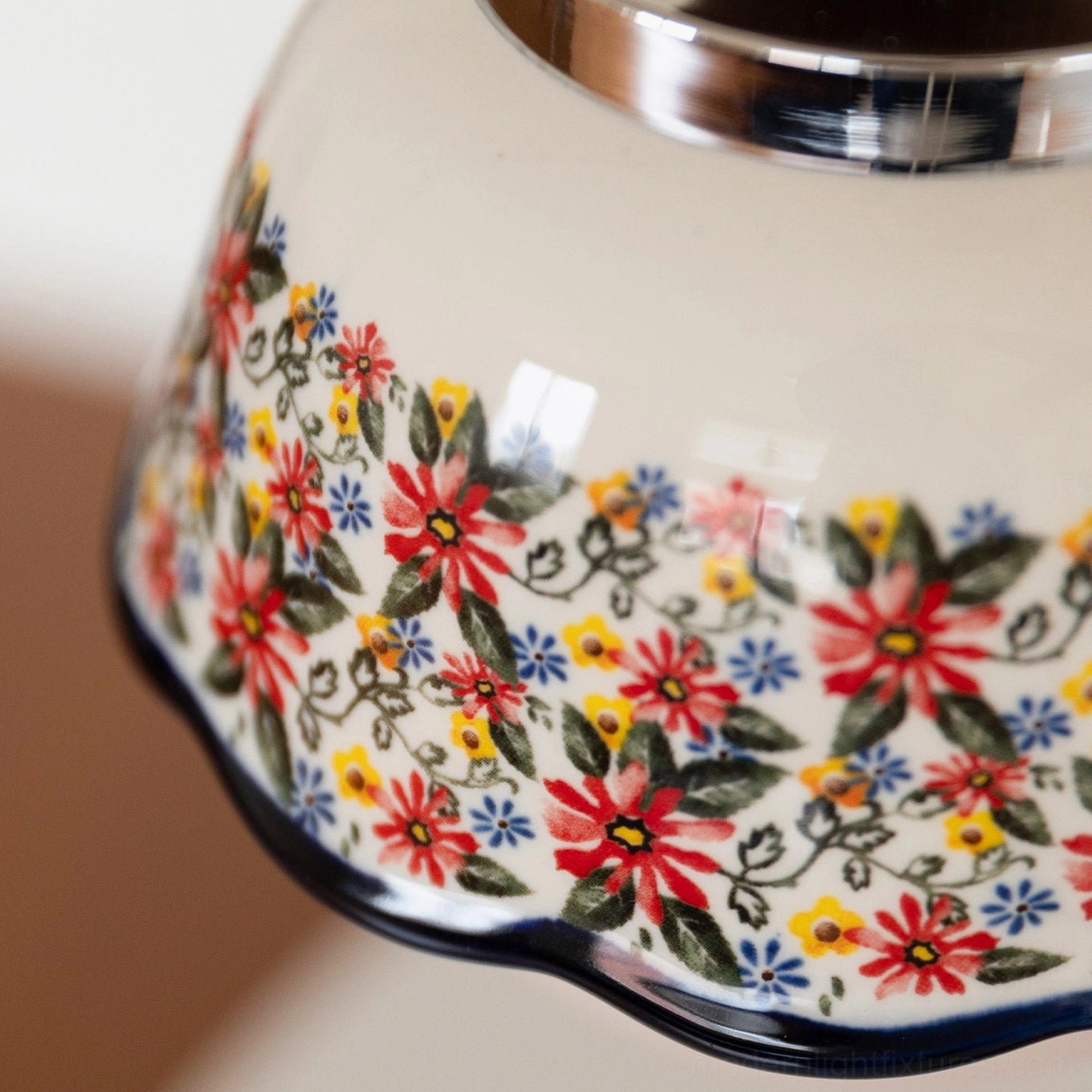 Bellora vintage floral pendant light creating warm ambient lighting in contemporary home with ceramic floral-print shade and wooden details