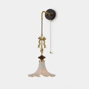 Bellora vintage wall sconce with frosted glass flower shade, brass arm, and walnut backplate - front studio view
