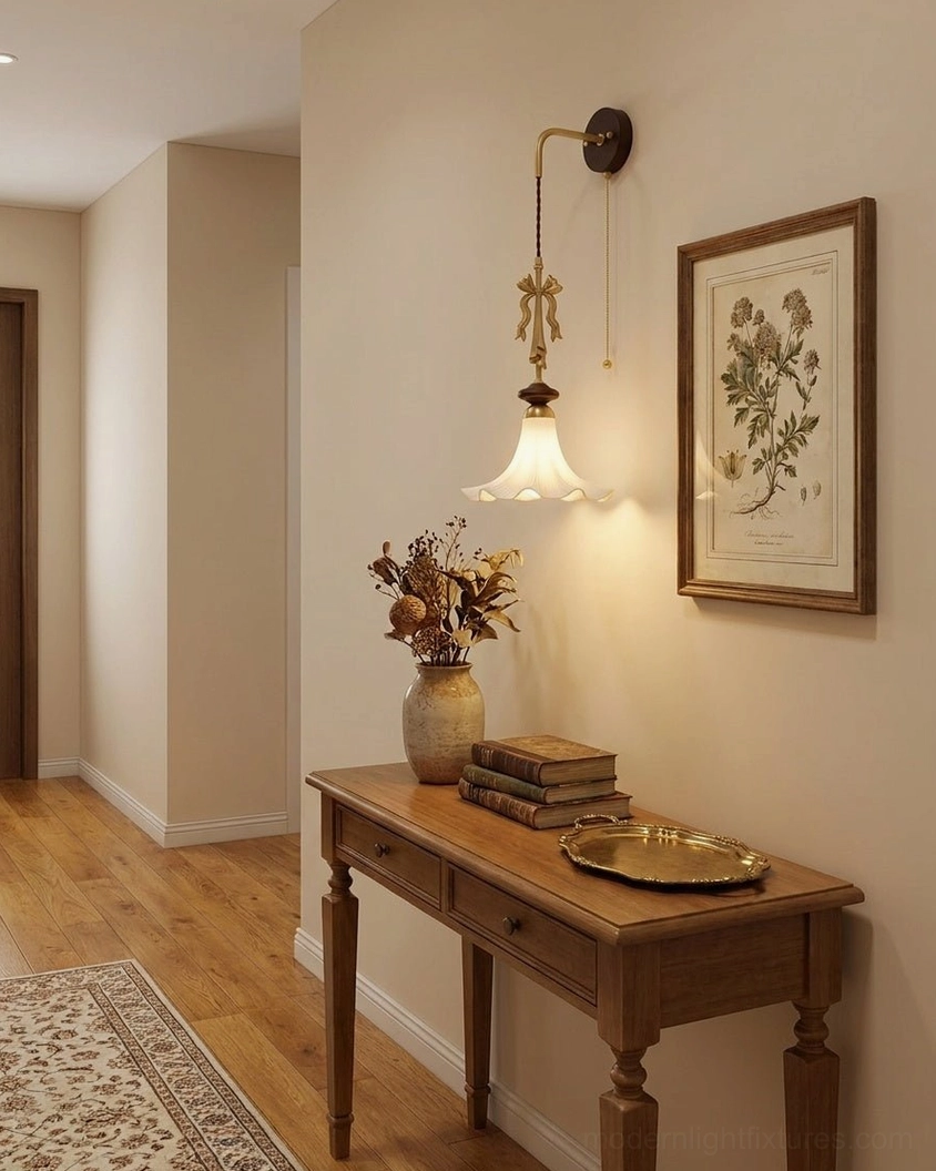 Bellora wall sconce installed in hallway - warm ambient lighting with brass hardware and frosted glass