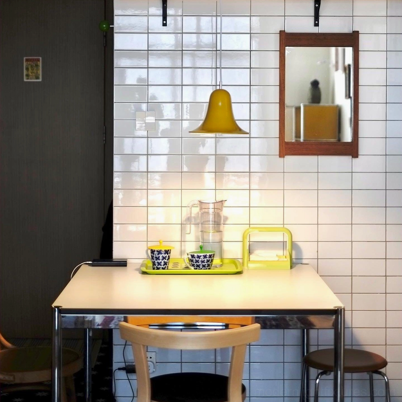 Yellow Bells pendant lamp creating ambient light in Nordic minimalist tiled dining room, contemporary pendant lighting interior
