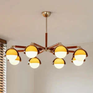 6-head Belmont chandelier with warm amber frosted glass shades installed in modern living room with ceiling lighting