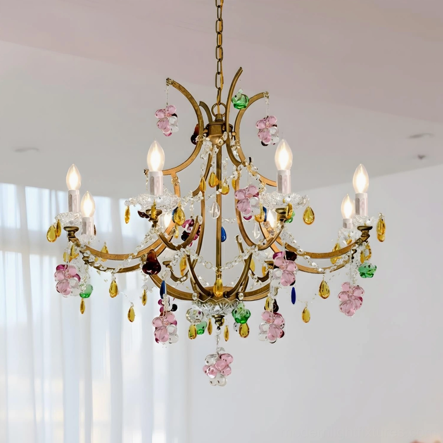 8-head Beloria crystal chandelier angled detail showing jewel-tone glass droplets and candle-style bulbs
