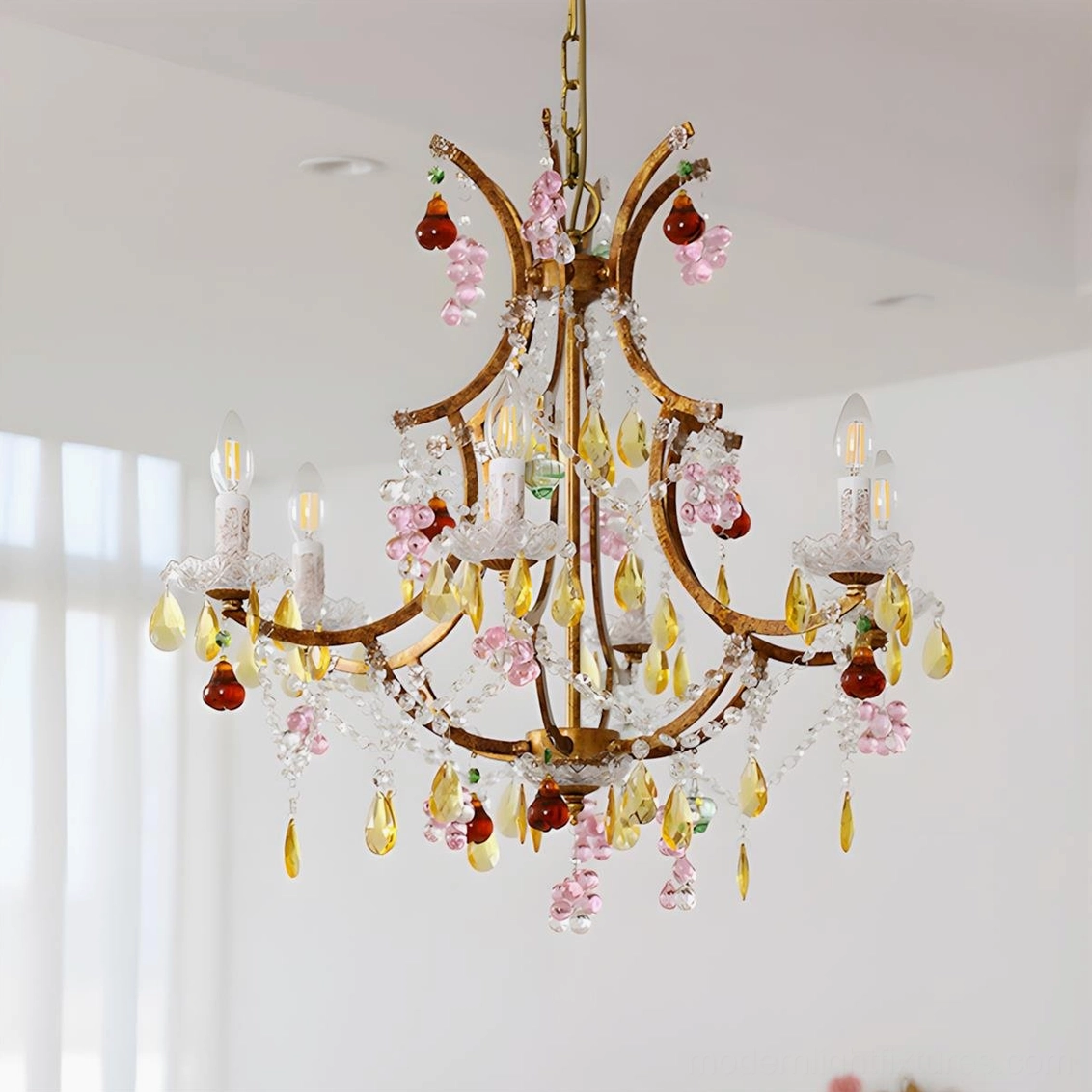 Beloria floral crystal pendant chandelier close-up showing hand-formed pink glass blossoms and emerald droplets