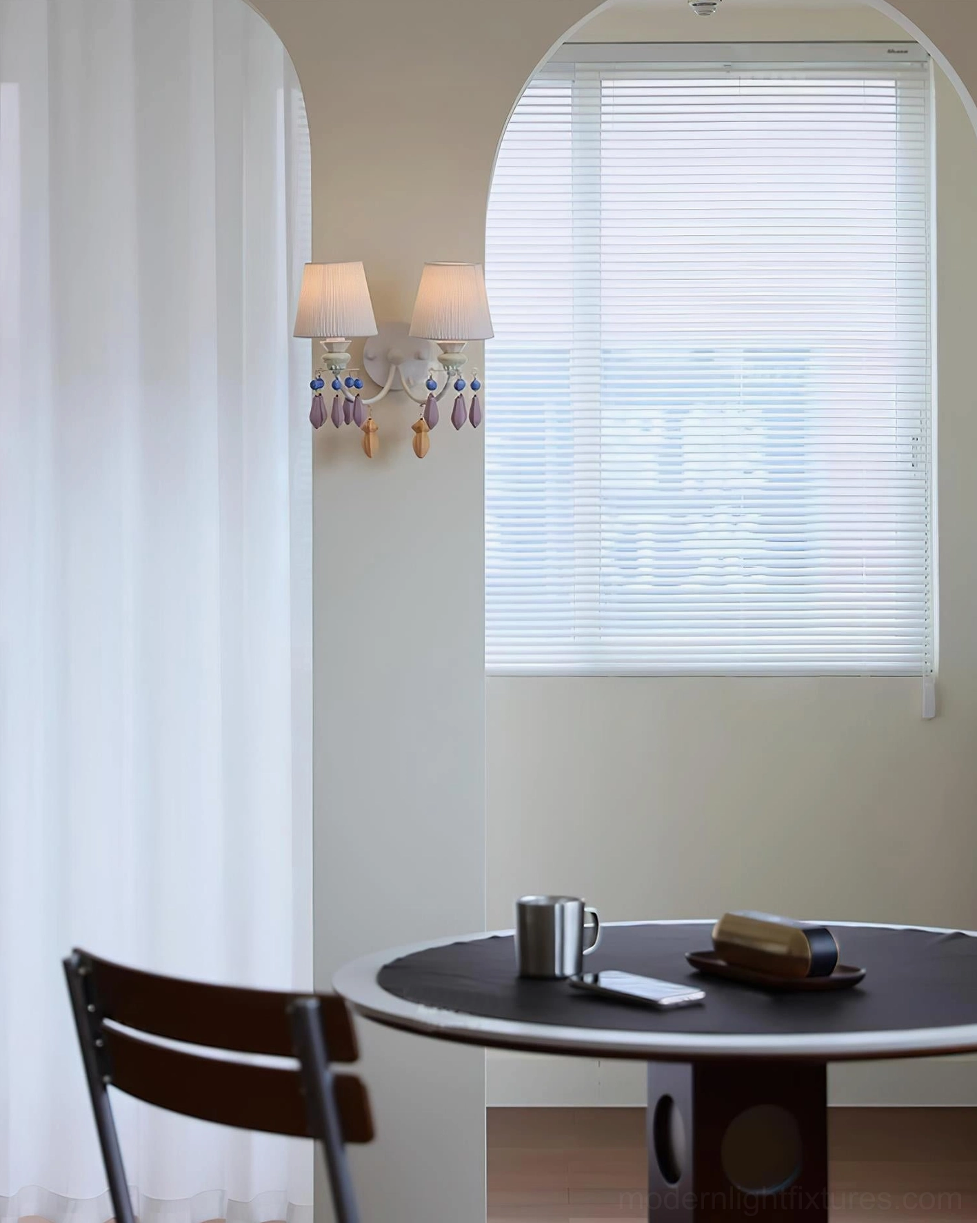 Belvianne double-head wall sconce mounted on archway in dining area with sheer curtain backdrop residential home lighting