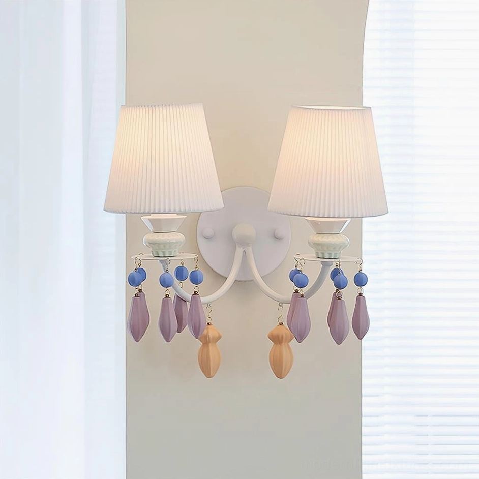 Belvianne double-head wall sconce with dual pleated ceramic shades and matching pastel bead pendants in residential interior setting