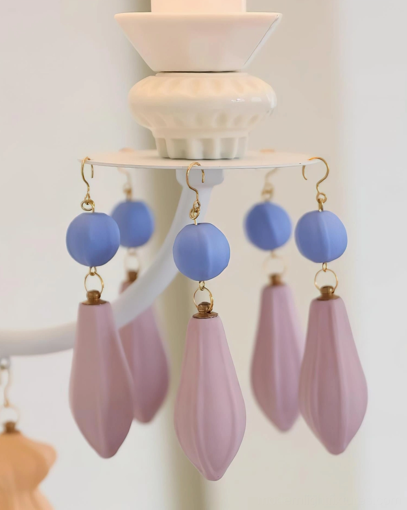 Belvianne ceramic wall sconce artistic detail showcasing pleated shade texture and decorative beaded pendant embellishments