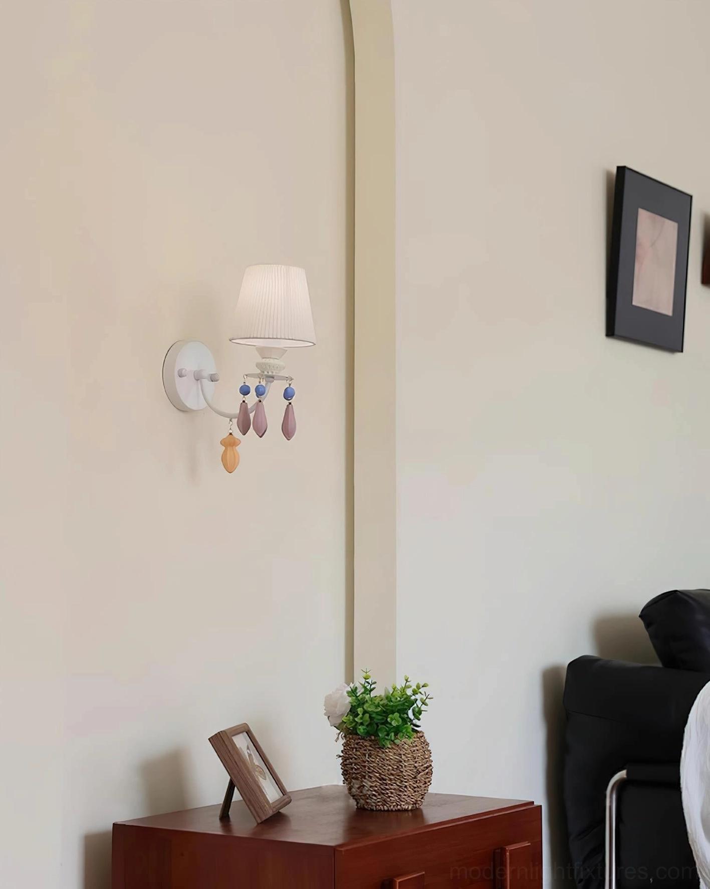 Belvianne ceramic wall sconce mounted in contemporary interior showing refined craftsmanship and elegant metal framework