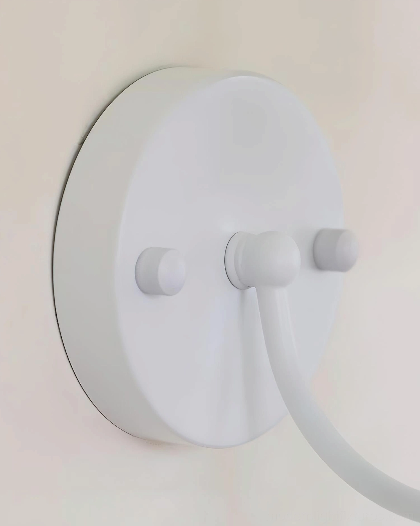Belvianne wall sconce modern Scandinavian design aesthetic in contemporary home interior with soft neutral wall tones