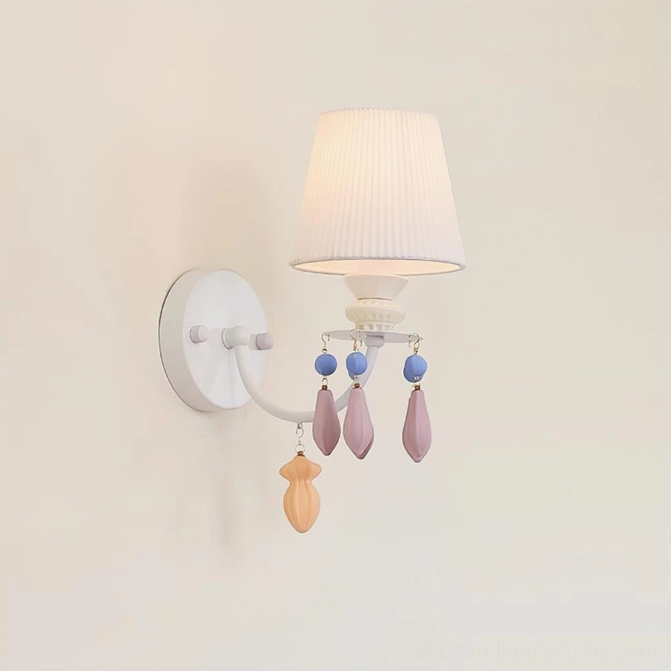 Belvianne single-head ceramic wall sconce with pleated shade on warm beige wall minimalist white metal mount close-up