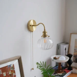 Vintage glass wall sconce brass hardware fluted clear glass shade in cozy home corner