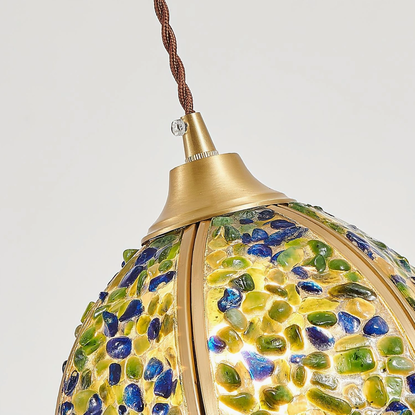 Beryl pendant lamp top-down view showing twisted brown fabric cord and brass mounting cap